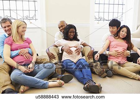 Stock Image - Couple Attending Ante Natal Class Together. Fotosearch