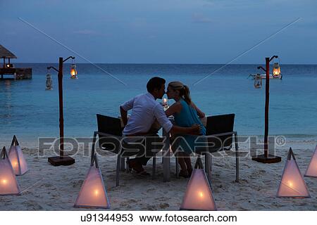 Couple Enjoying Late Meal In Outdoor Restaurant View Large Photo Image Stock Image - Couple Enjoying Late Meal In Outdoor Restaurant. Fotosearch