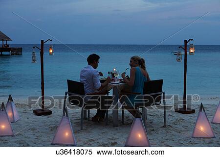Couple Enjoying Late Meal In Outdoor Restaurant View Large Photo Image Stock Photography - Couple Enjoying Late Meal In Outdoor Restaurant. Fotosearch