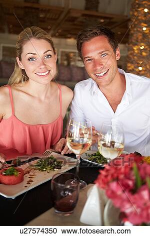 Couple Enjoying Meal In Restaurant View Large Photo Image Stock Image - Couple Enjoying Meal In Restaurant. Fotosearch