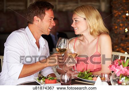 Couple Enjoying Meal In Restaurant View Large Photo Image Stock Photo - Couple Enjoying Meal In Restaurant. Fotosearch