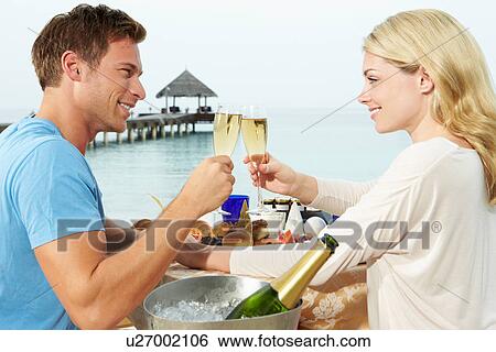Couple Enjoying Meal In Seafront Restaurant View Large Photo Image Stock Photograph - Couple Enjoying Meal In Seafront Restaurant. Fotosearch