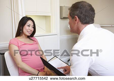 Couple Meeting With Obstetrician In Clinic View Large Photo Image Stock Image - Couple Meeting With Obstetrician In Clinic. Fotosearch