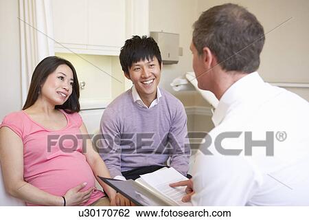 Couple Meeting With Obstetrician In Clinic View Large Photo Image Stock Image - Couple Meeting With Obstetrician In Clinic. Fotosearch