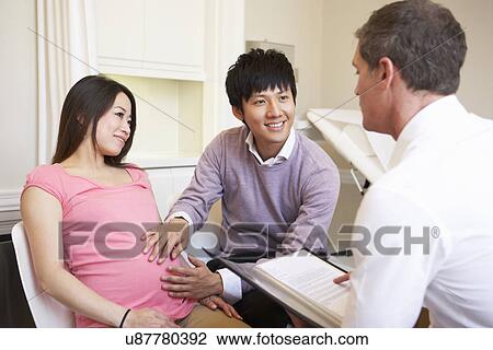 Couple Meeting With Obstetrician In Clinic View Large Photo Image Stock Image - Couple Meeting With Obstetrician In Clinic. Fotosearch