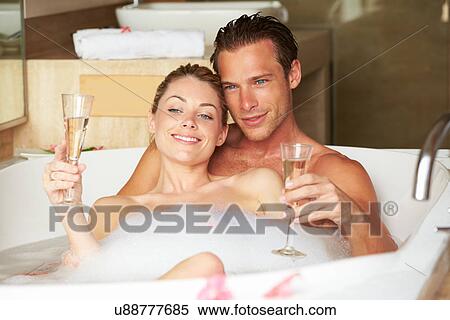 Couple Relaxing In Bath Drinking Champagne Together View Large Photo Image Stock Photography - Couple Relaxing In Bath Drinking Champagne Together. Fotosearch