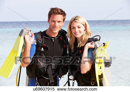 Couple With Scuba Diving Equipment Enjoying Beach Holiday View Large Photo Image Stock Photography - Couple With Scuba Diving Equipment Enjoying Beach Holiday. Fotosearch