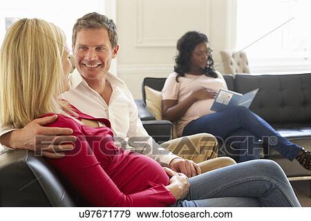 Stock Photo - Couples In Waiting Room Of Ante Natal Clinic. Fotosearch