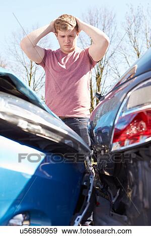 Driver Inspecting Damage After Traffic Accident View Large Photo Image Stock Photo - Driver Inspecting Damage After Traffic Accident. Fotosearch