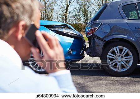 Picture - Driver Making Phone Call After Traffic Accident. Fotosearch