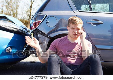 Stock Photo - Driver Making Phone Call After Traffic Accident. Fotosearch