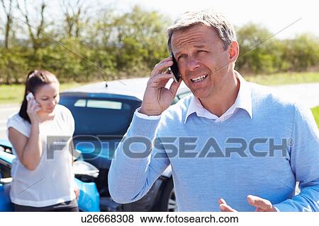 Driver Making Phone Call After Traffic Accident View Large Photo Image Stock Photo - Driver Making Phone Call After Traffic Accident. Fotosearch