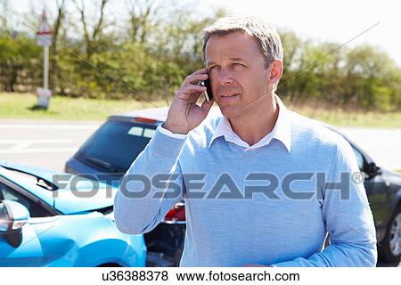 Driver Making Phone Call After Traffic Accident View Large Photo Image Stock Photo - Driver Making Phone Call After Traffic Accident. Fotosearch