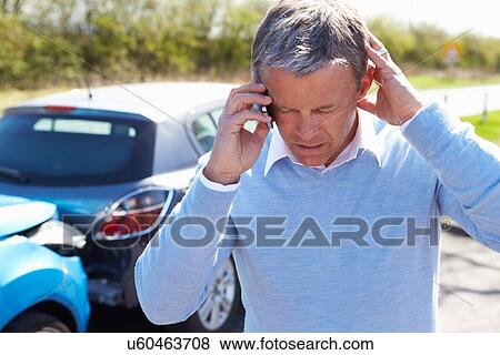 Driver Making Phone Call After Traffic Accident View Large Photo Image Stock Photo - Driver Making Phone Call After Traffic Accident. Fotosearch