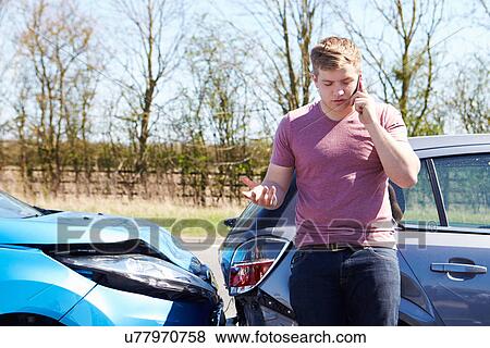 Stock Photo - Driver Making Phone Call After Traffic Accident. Fotosearch