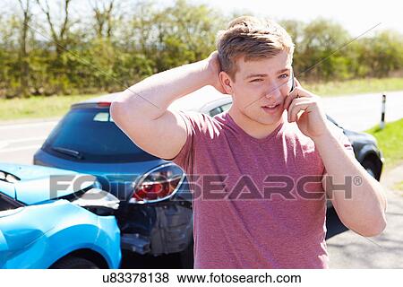 Stock Photo - Driver Making Phone Call After Traffic Accident. Fotosearch
