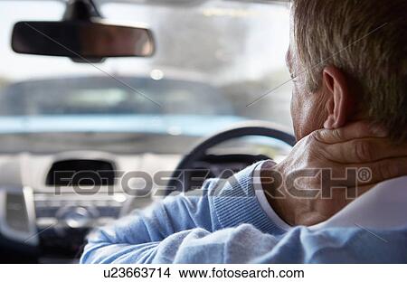 Picture - Driver Suffering From Whiplash After Traffic Collision. Fotosearch