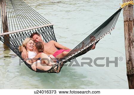 Family Relaxing In Beach Hammock View Large Photo Image Stock Image - Family Relaxing In Beach Hammock . Fotosearch