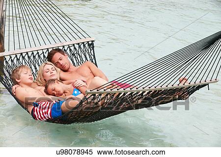 Family Relaxing In Beach Hammock View Large Photo Image Stock Photography - Family Relaxing In Beach Hammock . Fotosearch