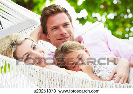 Family Relaxing In Beach Hammock With Sleeping Daughter View Large Photo Image Stock Image - Family Relaxing In Beach Hammock With Sleeping Daughter. Fotosearch