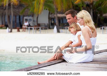 Family Sitting On Wooden Jetty View Large Photo Image Stock Photography - Family Sitting On Wooden Jetty. Fotosearch