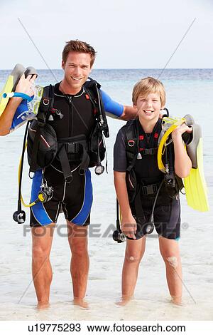 Father And Son With Scuba Diving Equipment On Beach Holiday View Large Photo Image Stock Image - Father And Son With Scuba Diving Equipment On Beach Holiday. Fotosearch