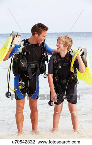 Father And Son With Scuba Diving Equipment On Beach Holiday View Large Photo Image Stock Image - Father And Son With Scuba Diving Equipment On Beach Holiday. Fotosearch