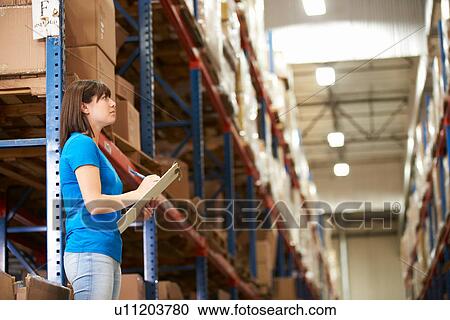 Female Worker In Distribution Warehouse View Large Photo Image Stock Image - Female Worker In Distribution Warehouse. Fotosearch