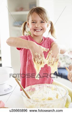 Girl Making Cupcakes In Kitchen View Large Photo Image Stock Photograph - Girl Making Cupcakes In Kitchen. Fotosearch