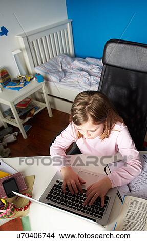 Girl Studying In Bedroom Using Laptop View Large Photo Image Picture - Girl Studying In Bedroom Using Laptop. Fotosearch