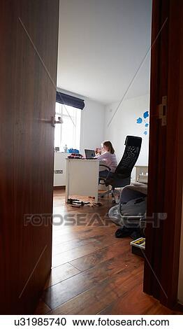 Girl Studying In Bedroom Using Laptop View Large Photo Image Stock Image - Girl Studying In Bedroom Using Laptop. Fotosearch