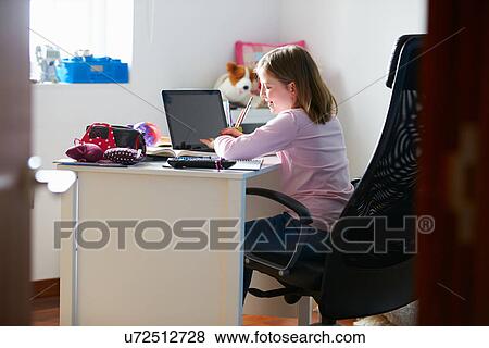 Girl Studying In Bedroom Using Laptop View Large Photo Image Stock Photo - Girl Studying In Bedroom Using Laptop. Fotosearch
