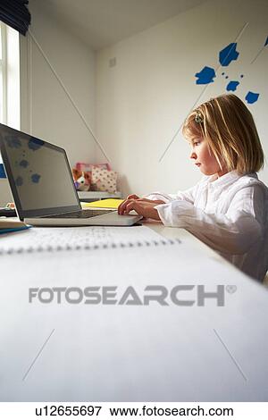Stock Photo - Girl Using Laptop In Bedroom. Fotosearch