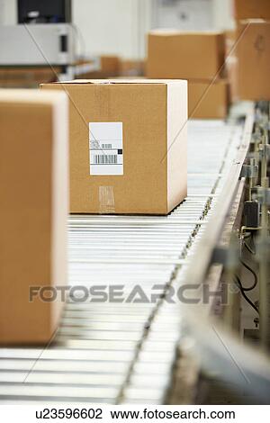 Goods On Conveyor Belt In Distribution Warehouse View Large Photo Image Stock Image - Goods On Conveyor Belt In Distribution Warehouse. Fotosearch