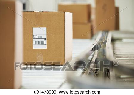 Goods On Conveyor Belt In Distribution Warehouse View Large Photo Image Stock Photo - Goods On Conveyor Belt In Distribution Warehouse. Fotosearch