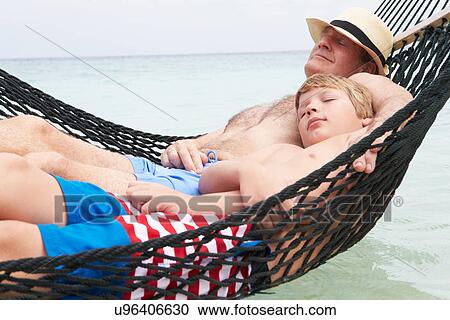 Grandfather And Grandson Relaxing In Beach Hammock View Large Photo Image Stock Image - Grandfather And Grandson Relaxing In Beach Hammock . Fotosearch