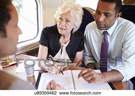 Group Of Businesspeople Having Meeting On Train View Large Photo Image Stock Image - Group Of Businesspeople Having Meeting On Train. Fotosearch