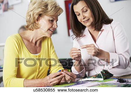 Group Of Women Making Quilt Together View Large Photo Image Stock Photography - Group Of Women Making Quilt Together. Fotosearch