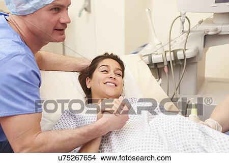 Husband Supporting Wife Through IVF Treatment View Large Photo Image Picture - Husband Supporting Wife Through IVF Treatment. Fotosearch