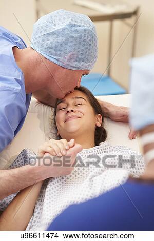 Husband Supporting Wife Through IVF Treatment View Large Photo Image Picture - Husband Supporting Wife Through IVF Treatment. Fotosearch