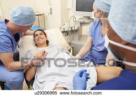 Stock Photography - Husband Supporting Wife Through IVF Treatment. Fotosearch