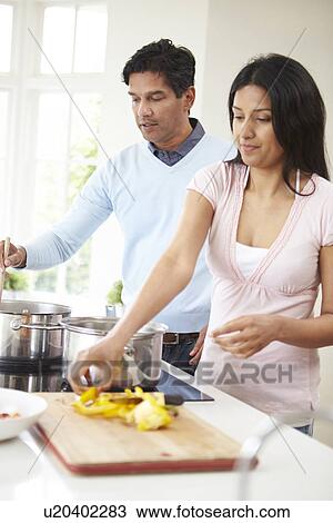Indian Couple Cooking Meal At Home View Large Photo Image Stock Image - Indian Couple Cooking Meal At Home. Fotosearch