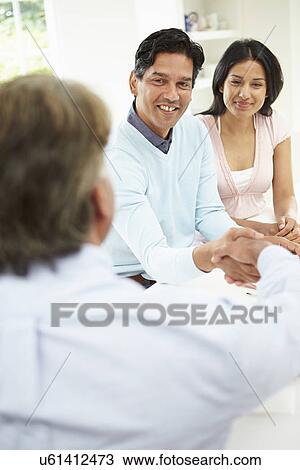 Indian Couple Meeting With Financial Advisor At Home View Large Photo Image Stock Image - Indian Couple Meeting With Financial Advisor At Home. Fotosearch