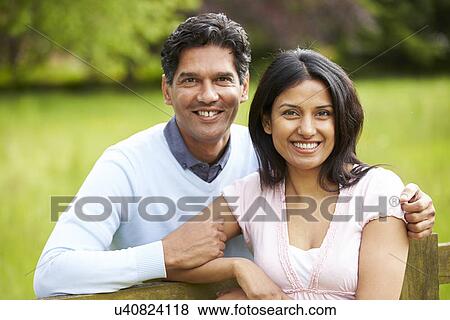 Stock Photo - Indian Couple Walking In Countryside. Fotosearch