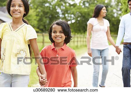 Indian Family Walking In Countryside View Large Photo Image Stock Image - Indian Family Walking In Countryside. Fotosearch