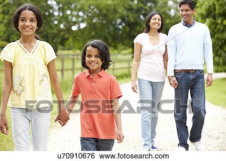 Indian Family Walking In Countryside View Large Photo Image Stock Photograph - Indian Family Walking In Countryside. Fotosearch