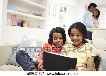Indian Family With Digital Tablet At Home View Large Photo Image Stock Photography - Indian Family With Digital Tablet At Home. Fotosearch