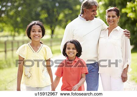 Indian Grandparents And Grandchildren Walking In Countryside View Large Photo Image Stock Photo - Indian Grandparents And Grandchildren Walking In Countryside. Fotosearch