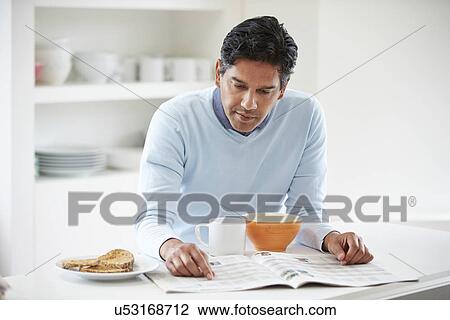 Indian Man Enjoying Breakfast At Home View Large Photo Image Stock Image - Indian Man Enjoying Breakfast At Home. Fotosearch