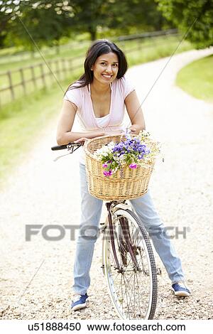 Indian Woman On Cycle Ride In Countryside View Large Photo Image Stock Image - Indian Woman On Cycle Ride In Countryside. Fotosearch